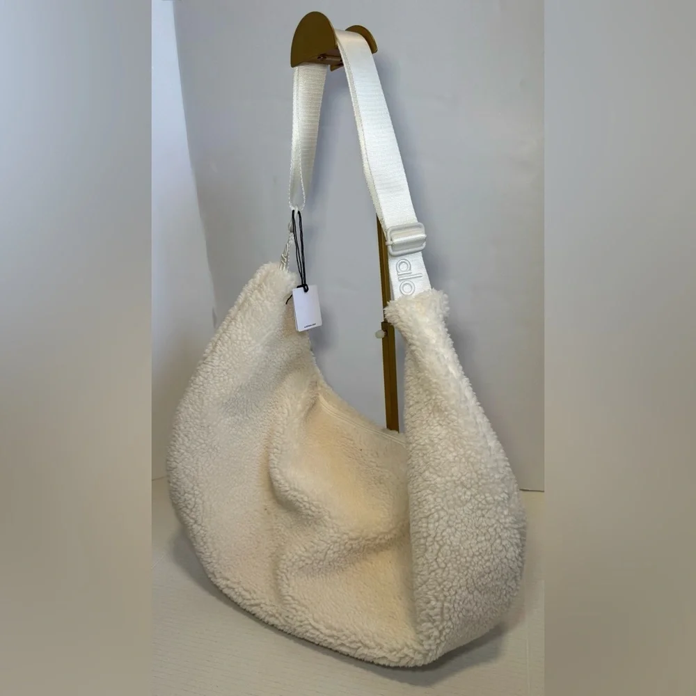 Alo Yoga Sherpa On The Go Sling Bag in ivory